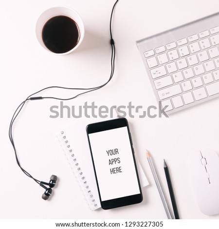 Keyboard and coffee on white background. The view from the top. The concept of home office or freelance