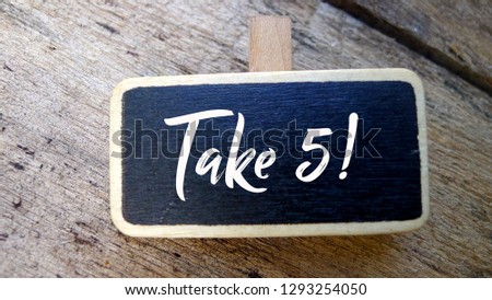 Selective focus on chalk board written with Take 5 (five) text