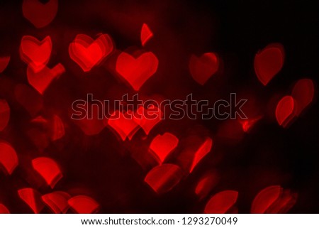 Saint Valentine's red hearths light for postcards or banners. Picture of bokeh vibrant love light