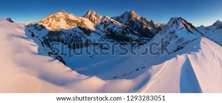 Stunning view of Mont Blanc massif and his melting glaciers. Winter adventures in the Italian French Alps. 
Courmayeur, Aosta Valley. Italy
Val Veny, and the ski slopes of the Courmayeur ski domain.
