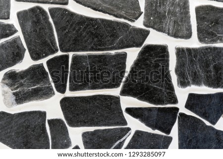Background of natural black stones in the interior.