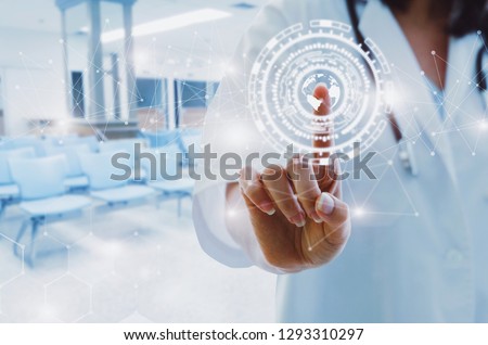 female doctor with stethoscope hand pointing touching world map data digital icon hologram with blurred image of lobby for waiting in hospital background, medical innovation, future technology concept