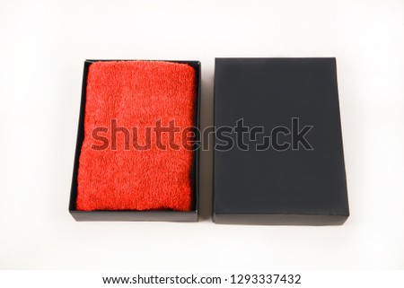 Towel packed in paper gift box isolate on white background.