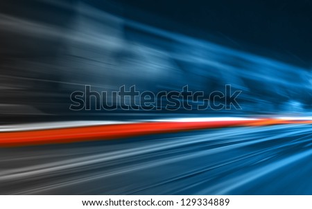 Car lights in motion Royalty-Free Stock Photo #129334889