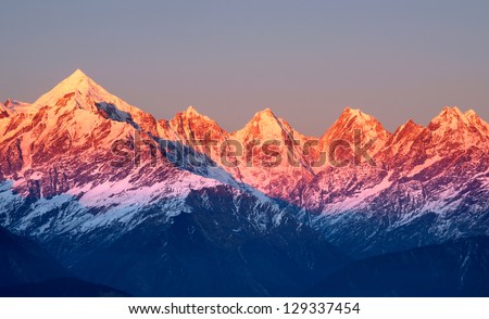 close shot of reddish mountain peaks during sun set Royalty-Free Stock Photo #129337454