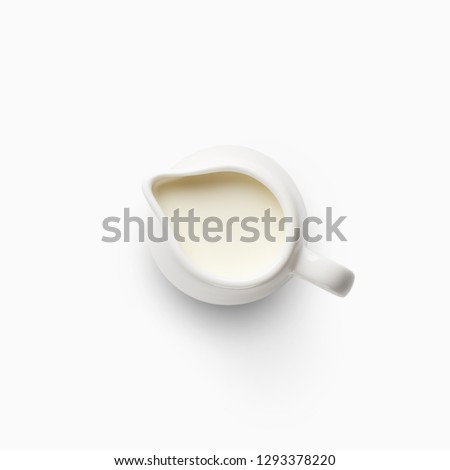 Milk jug isolated on white background., top view. Dairy product and healthy food concept Royalty-Free Stock Photo #1293378220