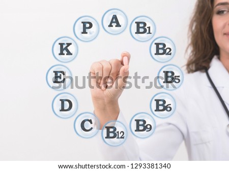All you need in small pill. Woman doctor holding capsule in hand, minerals assortment around it on virtual screen