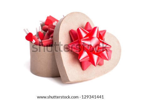 Opened heart shaped gift box with red bow. Isolated on white.