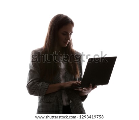 Silhouette of beautiful businesswoman with laptop on white background
