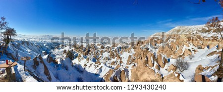 Snowy extraordinary rocks formations rock hills on winter time in, Cappadocia, Nevsehir,  Turkey