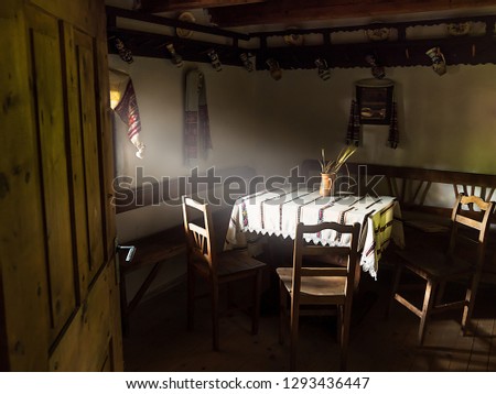 Interior of a traditional house from Apuseni Mountains. Past life in the country in Romania. Transylvanian traditional vintage old house in the countryside. Rural house interior Royalty-Free Stock Photo #1293436447