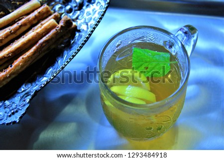 linden tea hot drink healty salty cookie salty biscuit silver plates lemon