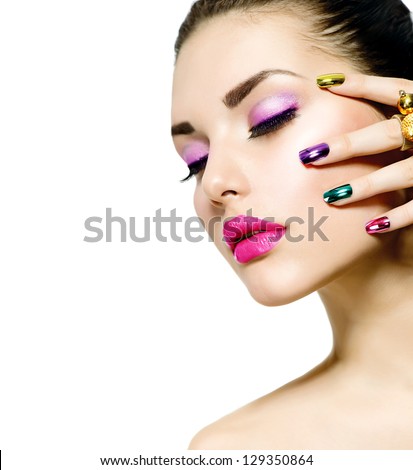 Fashion Beauty . Manicure and Make-up. Nail art. Beautiful Woman With Colorful Nails and Luxury Makeup. Beautiful Girl Face and Hand