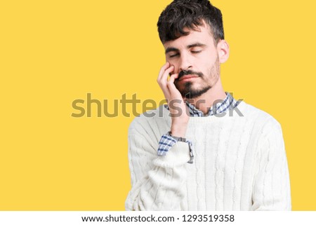 Young handsome man wearing winter sweater over isolated background thinking looking tired and bored with depression problems with crossed arms.