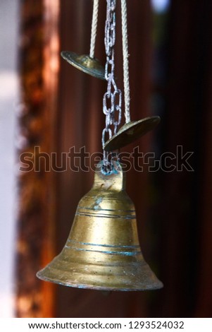 Bronze bell at the front door to the house. Hikkaduwa, Sri-Lanka.