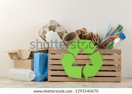 Eco symbol and trash in the box. recycling. waste recycling. on a light background