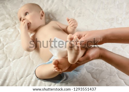 Feet of baby close up. Childish legs. Things to know about newborns. concept cleaning wipe, pure, clean. Infant nappy change and skin care.