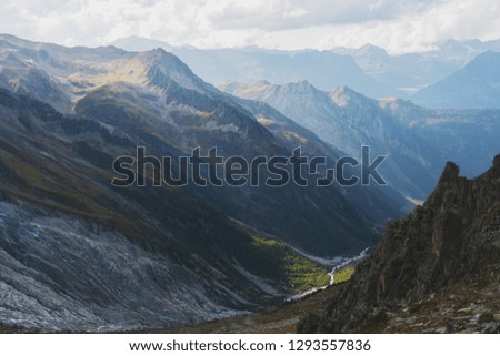 Landscape with Swiss alpine mountains with glaciers and sunset.