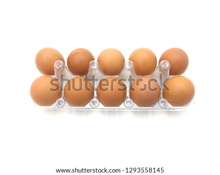Eggs in a plastic package on white background