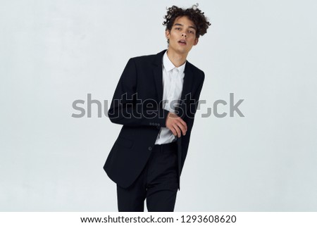 Business man in black suit rising office on gray background
