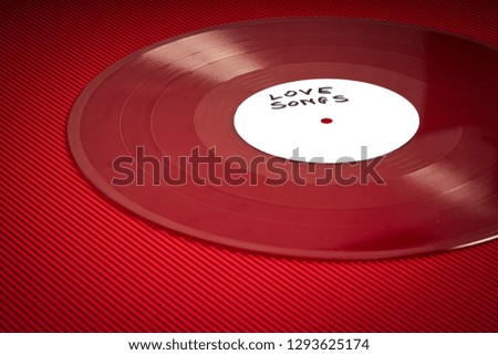 Valentines Day background with red LP record with love songs on fiery red background