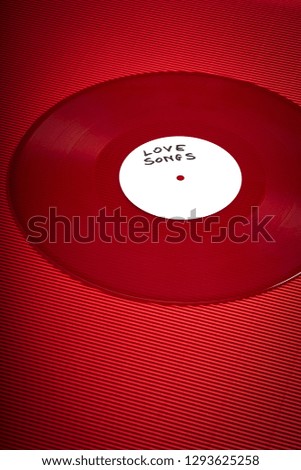 Valentines Day background with red LP record with love songs on fiery red background
