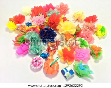 Alms flowers (Ribbon flowers),Thai culture.Coin folding with ribbon Colorful ribbon flower wrap donated for ordination