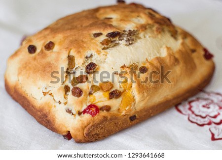 homemade baking muffin bread bread with raisins and cherries on canvas