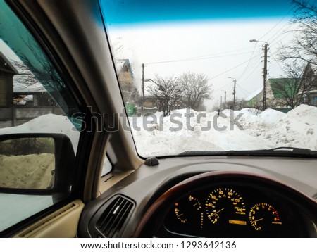 inside the car, winter road in the snow, travel by car, a lot of snow, driving