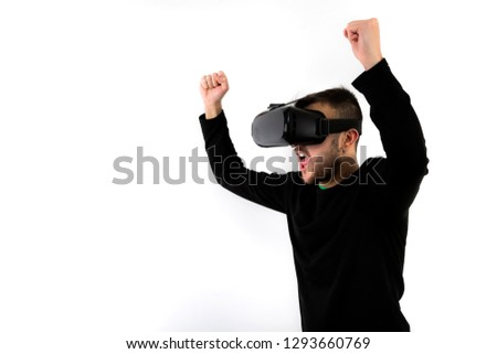 screaming bearded young man nice and modern with vr glasses enjoying virtual reality with a simulator isolated on white background