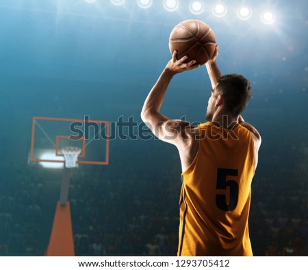 Professional basketball player shoots a three point shot 