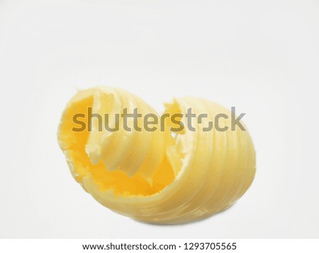 Roll of butter on an isolated background. Picture is ideal for advertising all kinds of dairy products 