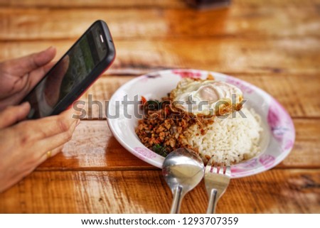 she is taking photo thai food at restaurant, Bangkok​Thailand​