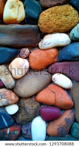 stones   are arranged Multi colorful . It is a beautiful art close up in natural. 
