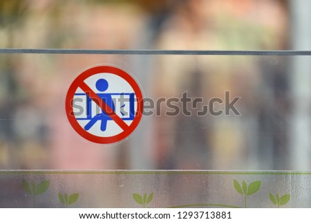 Do not sit on the bar signage