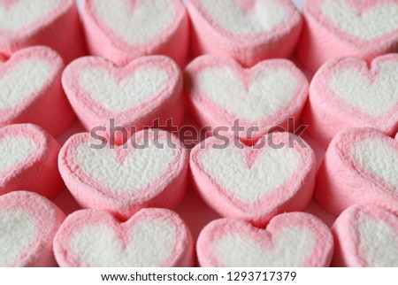 Lined Up Pastel Pink and White Heart Shaped Marshmallow Candies for Background, Banner, Pattern
