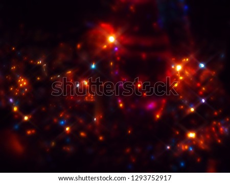 Blurred colored holiday lights as background.          