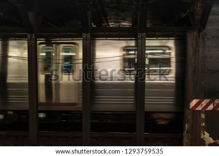 Train car in motion in a subway station of New York City, USA