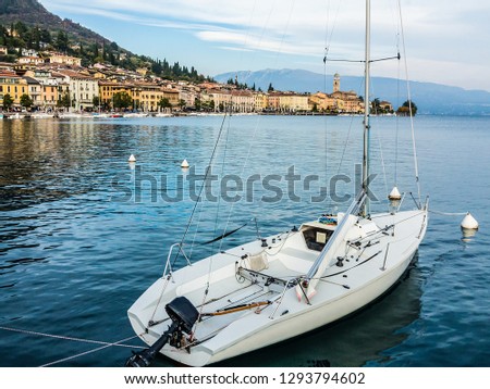 Sailboat with Salò in the background-Garda lake-Italy