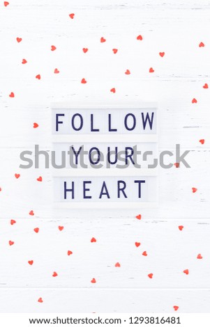 Creative Valentine Day romantic composition flat lay top view love holiday celebration with red heart lightbox white wooden background copy space Template greeting card text design social media blogs