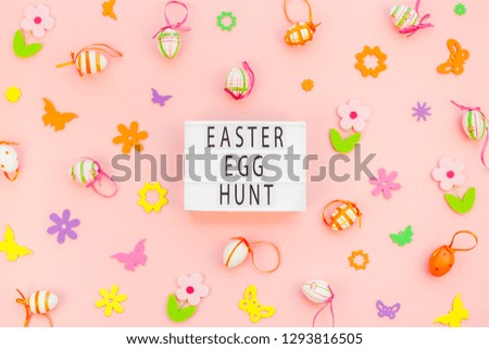Creative Top view flat lay holiday composition Easter egg hunt text on lightbox pink paper background copy space Template Easter day seasonal pattern