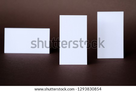 Business cards on a dark background; close-up shot