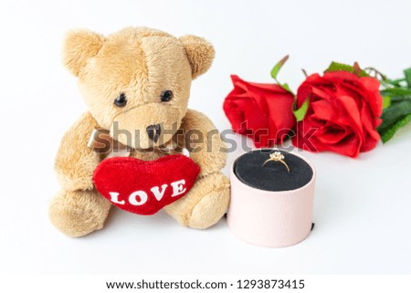 Women's ring, teddy bear and roses for valentine's day