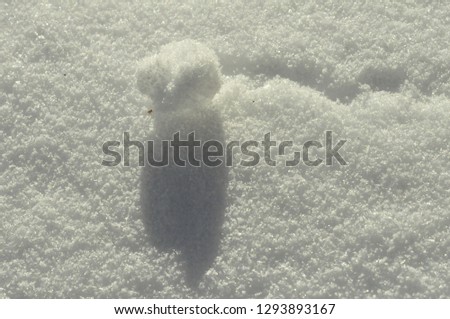 Snowball on snow-covered ground