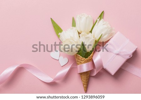 Flat-lay waffle cone with white flower blossom