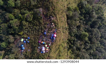 colorful camping on the green mountain in bird eyes view