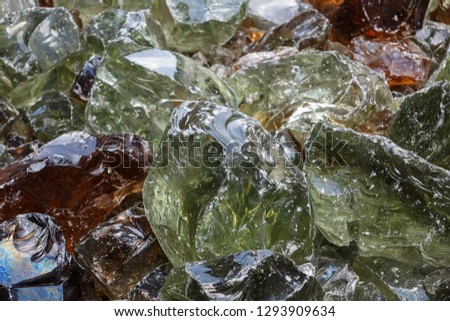 large pieces of broken glass close-up. Erklez. large pieces of broken glass close-up. Fragments of colored broken glass.
Some colorful glass stones