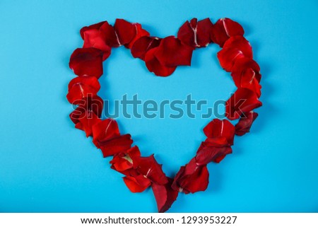 Rose lined heart on a blue background