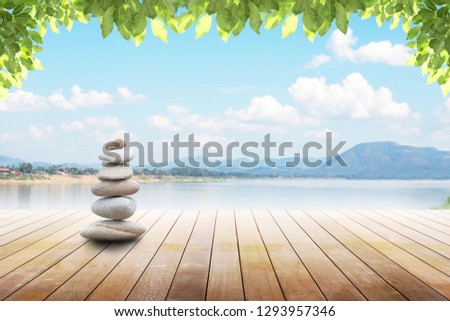 zen stones on wooden with beautiful natural river background,