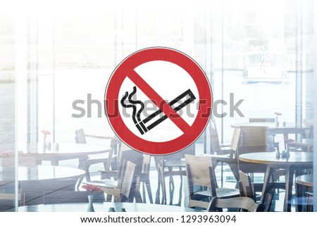 no smoking sign on window of   restaurant / cafe